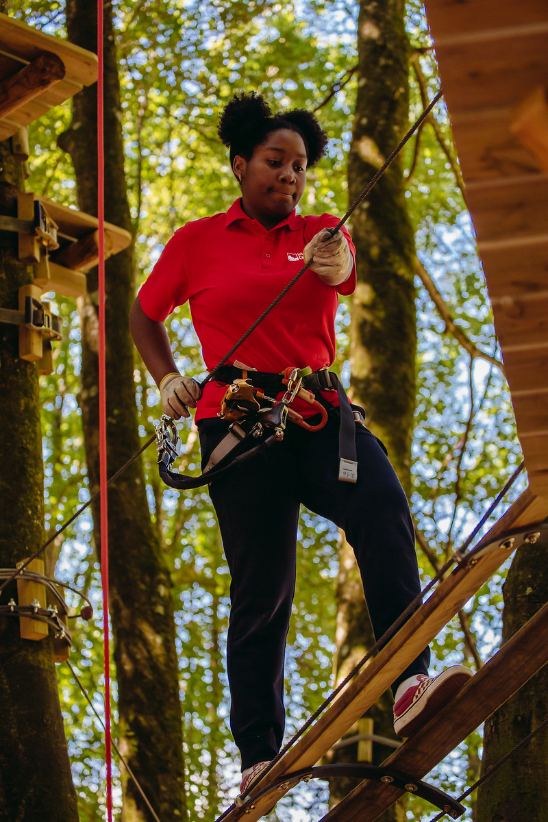 climbing through the trees at parc adventure